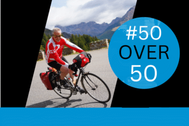 Rob Mcivor descends the Col de Vars wearing red cycling gear. The image also carries the #50Over50 logo