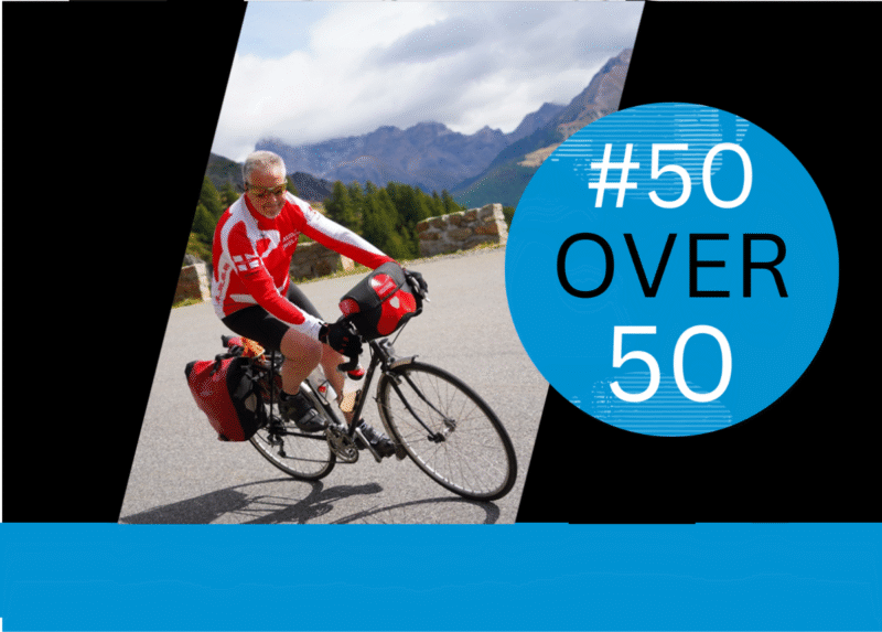 Rob Mcivor descends the Col de Vars wearing red cycling gear. The image also carries the #50Over50 logo